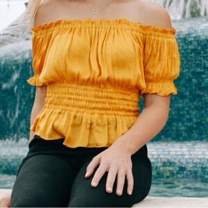 Gold puff sleeve smocked top Sz S boat neckline wide elastic waist, satin feel